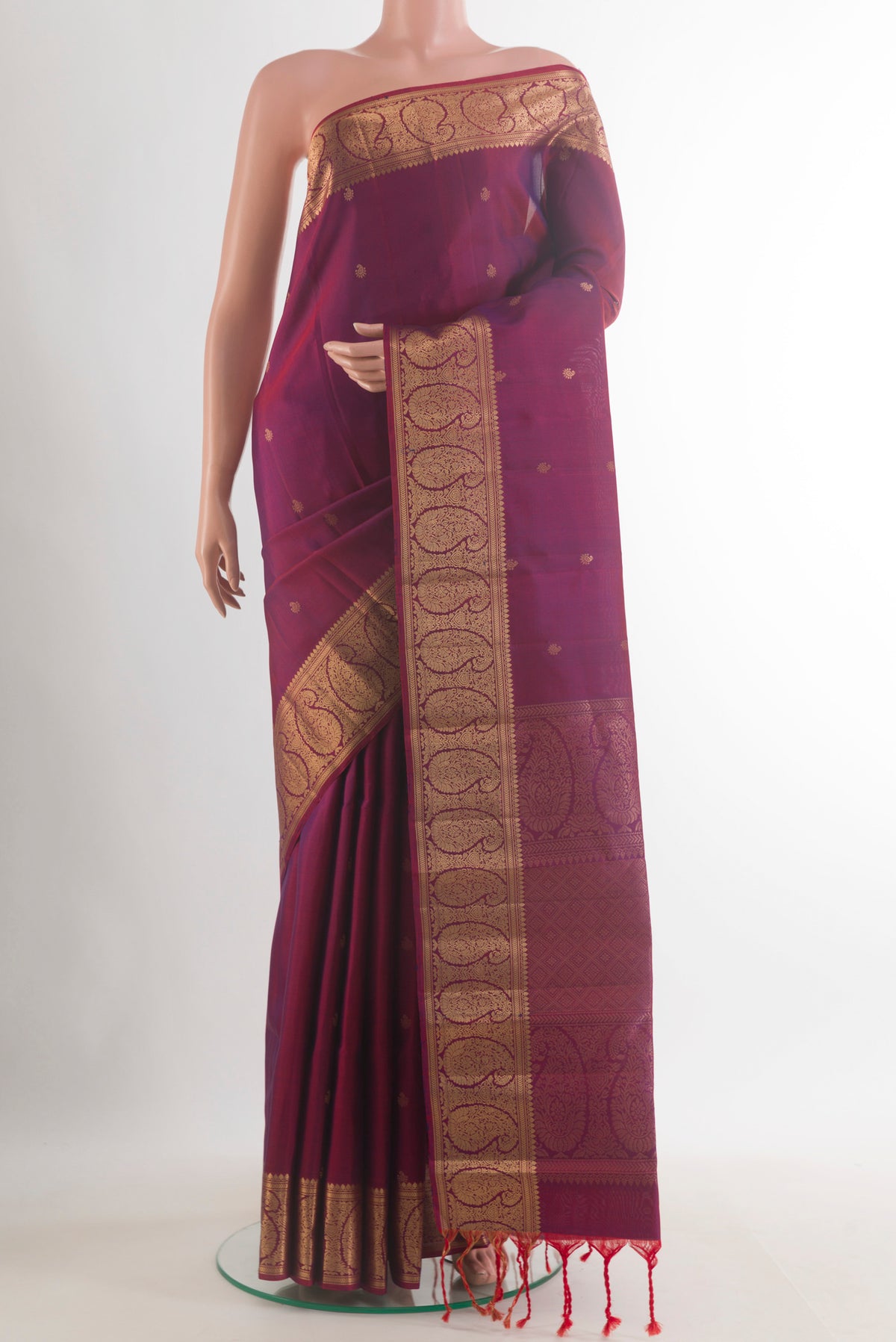 Pure Silk Magenta Dual Tone Kanchipuram Saree with Zari Butta on the body and Zari Border.  displayed on a mannequin