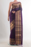 Pure Silk Purple Kanchipuram Saree with Zari Butta on the body and Zari Border.  displayed on a mannequin
