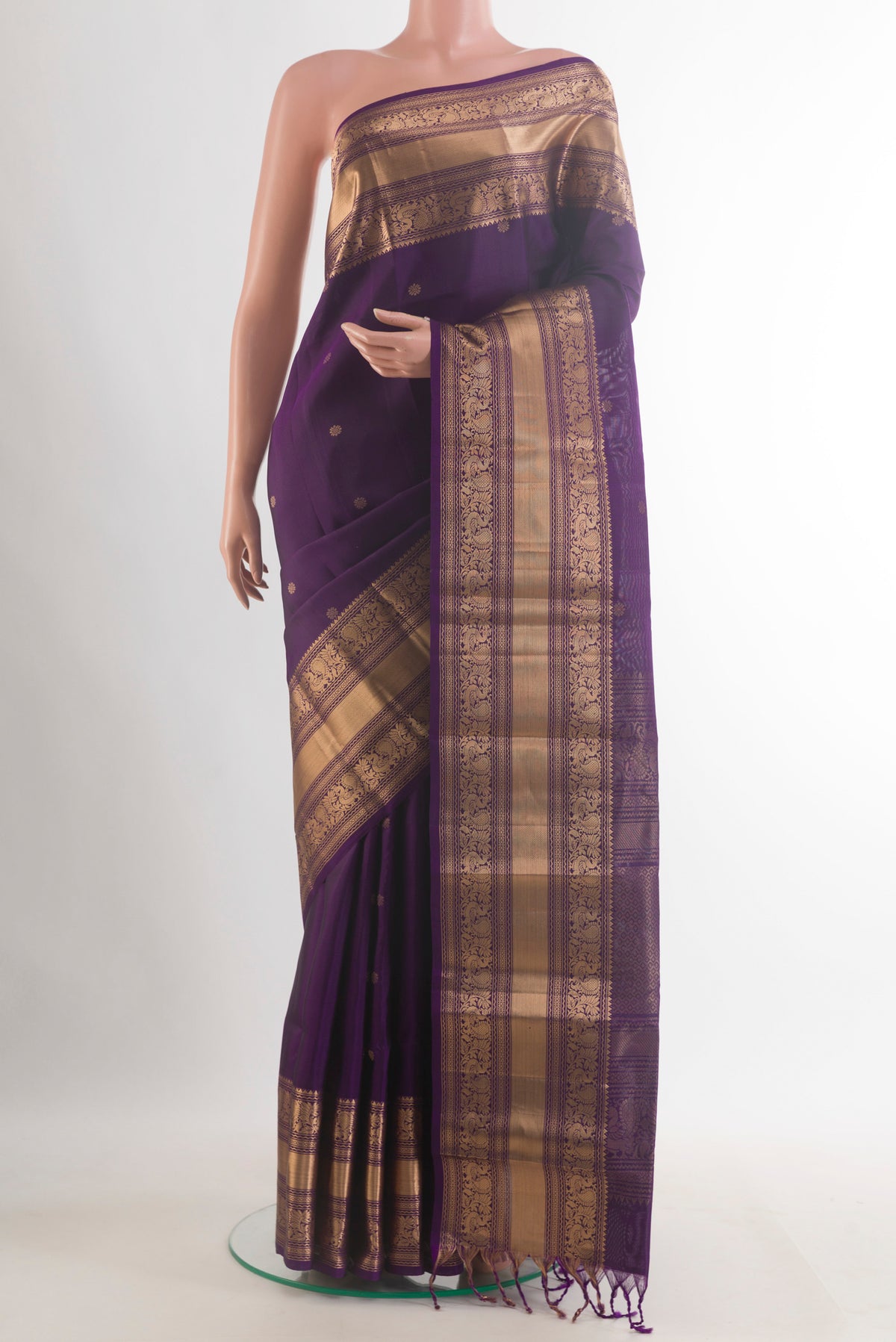 Pure Silk Purple Kanchipuram Saree with Zari Butta on the body and Zari Border.  displayed on a mannequin