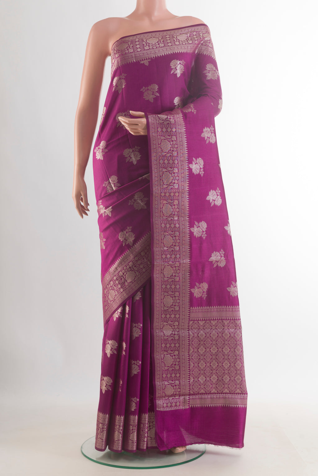 Purple Tussar Saree with Zari Butta on the body and Zari Border.  displayed on a mannequin