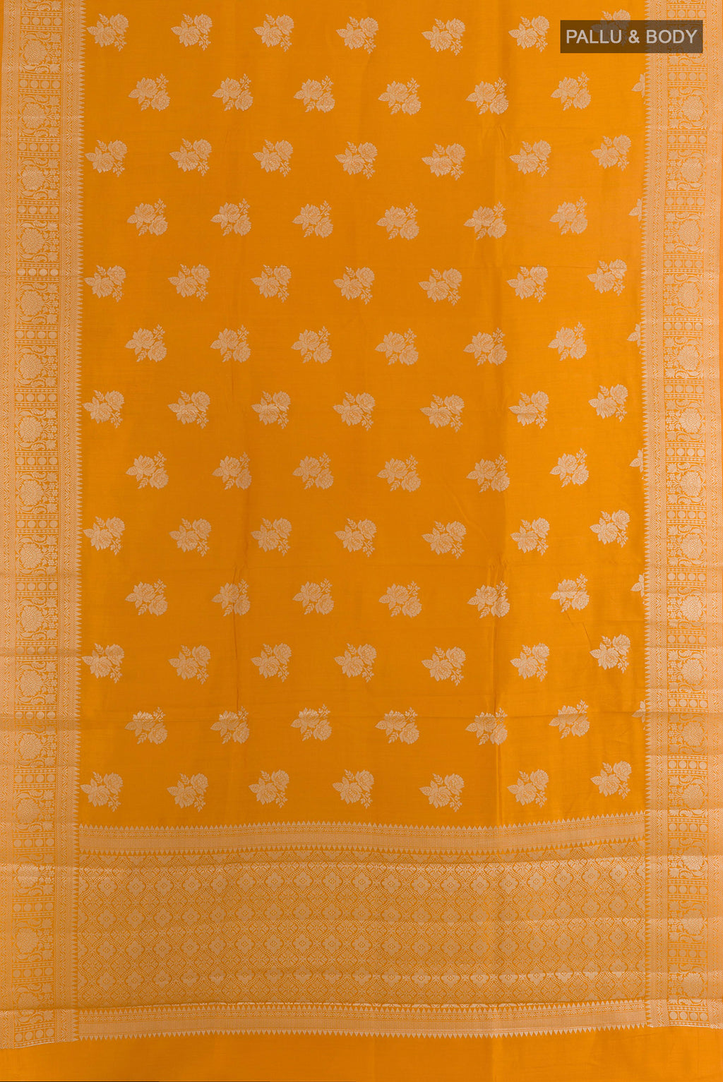 Flat view of Yellow Tussar Saree with Zari Butta on the body and Zari Border. 