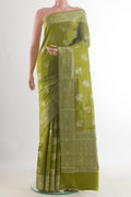 Mehandi Green Tussar Saree with Zari Butta on the body and Zari Border.  displayed on a mannequin