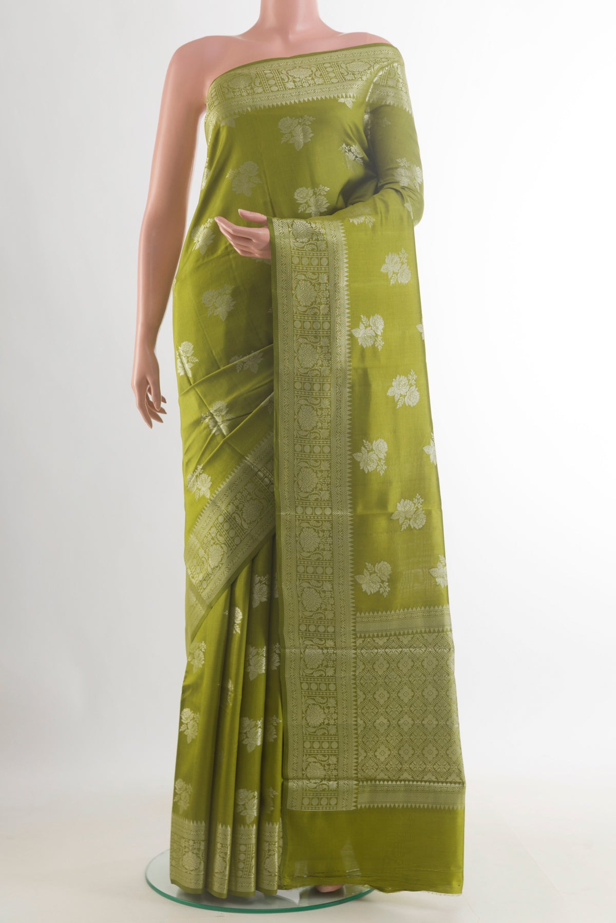 Mehandi Green Tussar Saree with Zari Butta on the body and Zari Border.  displayed on a mannequin
