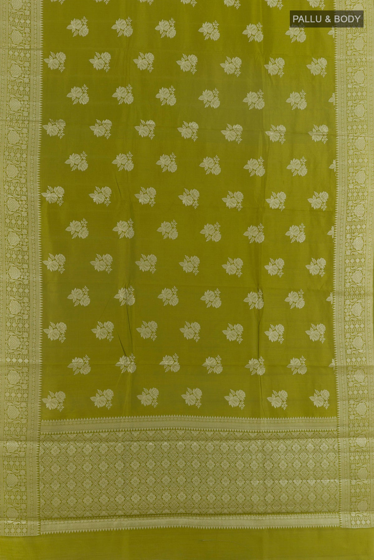 Flat view of Mehandi Green Tussar Saree with Zari Butta on the body and Zari Border. 