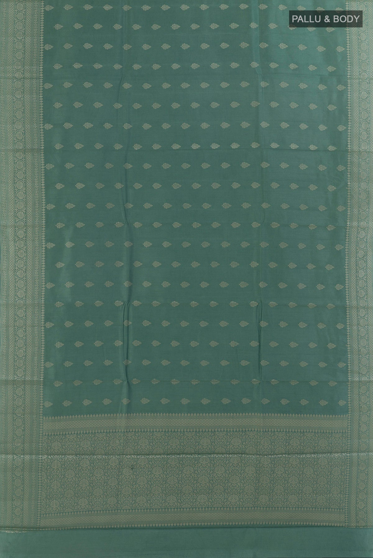 Flat view of Sage Green Tussar Saree with Zari Butta on the body and Zari Border. 
