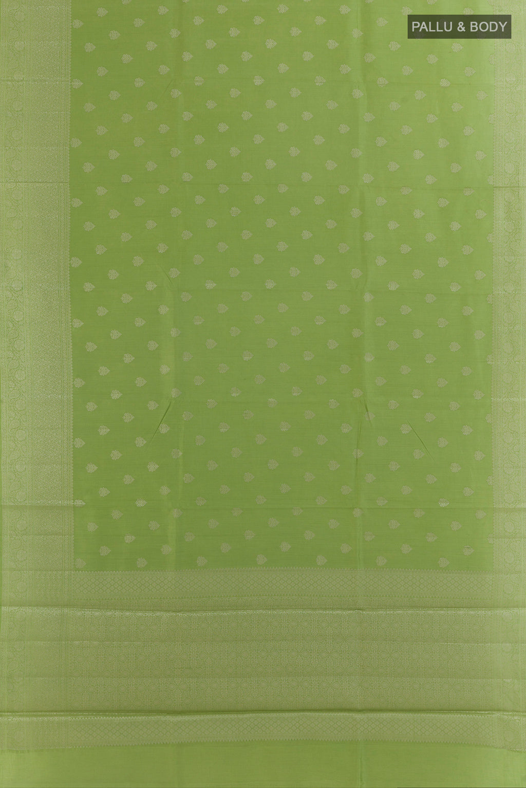 Flat view of Green Tussar Saree with Zari Butta on the body and Zari Border. 