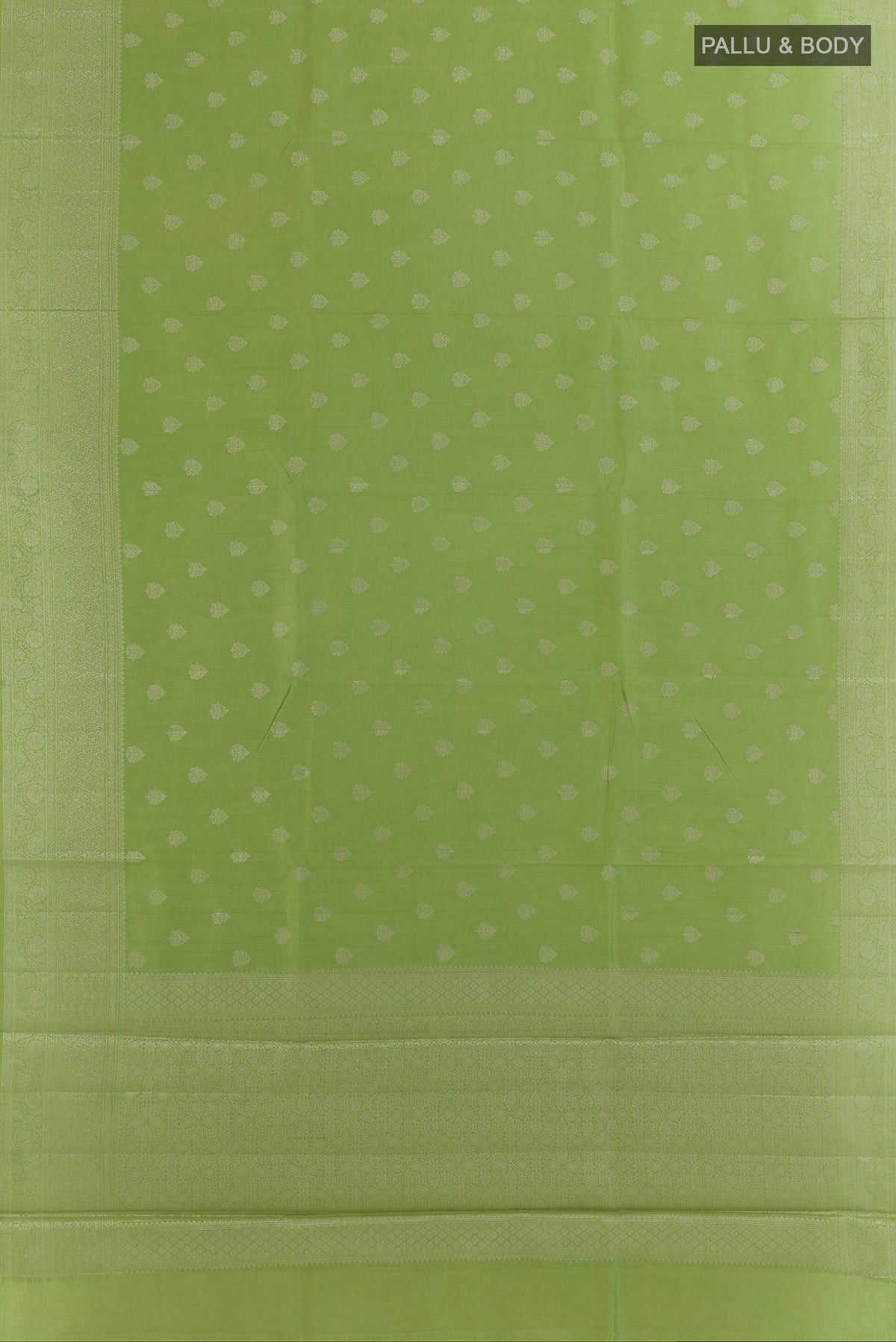 Flat view of Green Tussar Saree with Zari Butta on the body and Zari Border. 