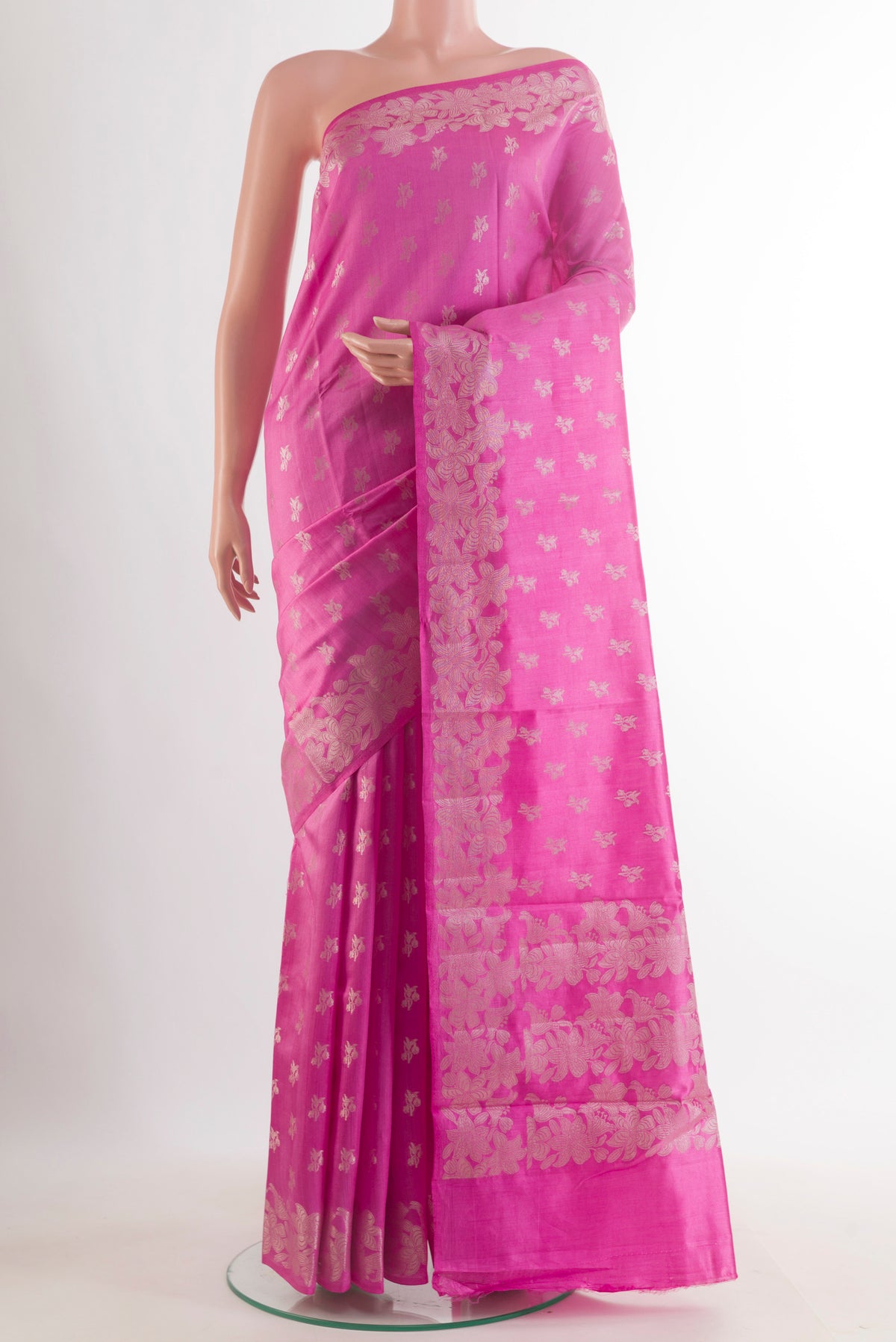 Pink Tussar Saree with Zari Butta on the body and Zari Border.  displayed on a mannequin