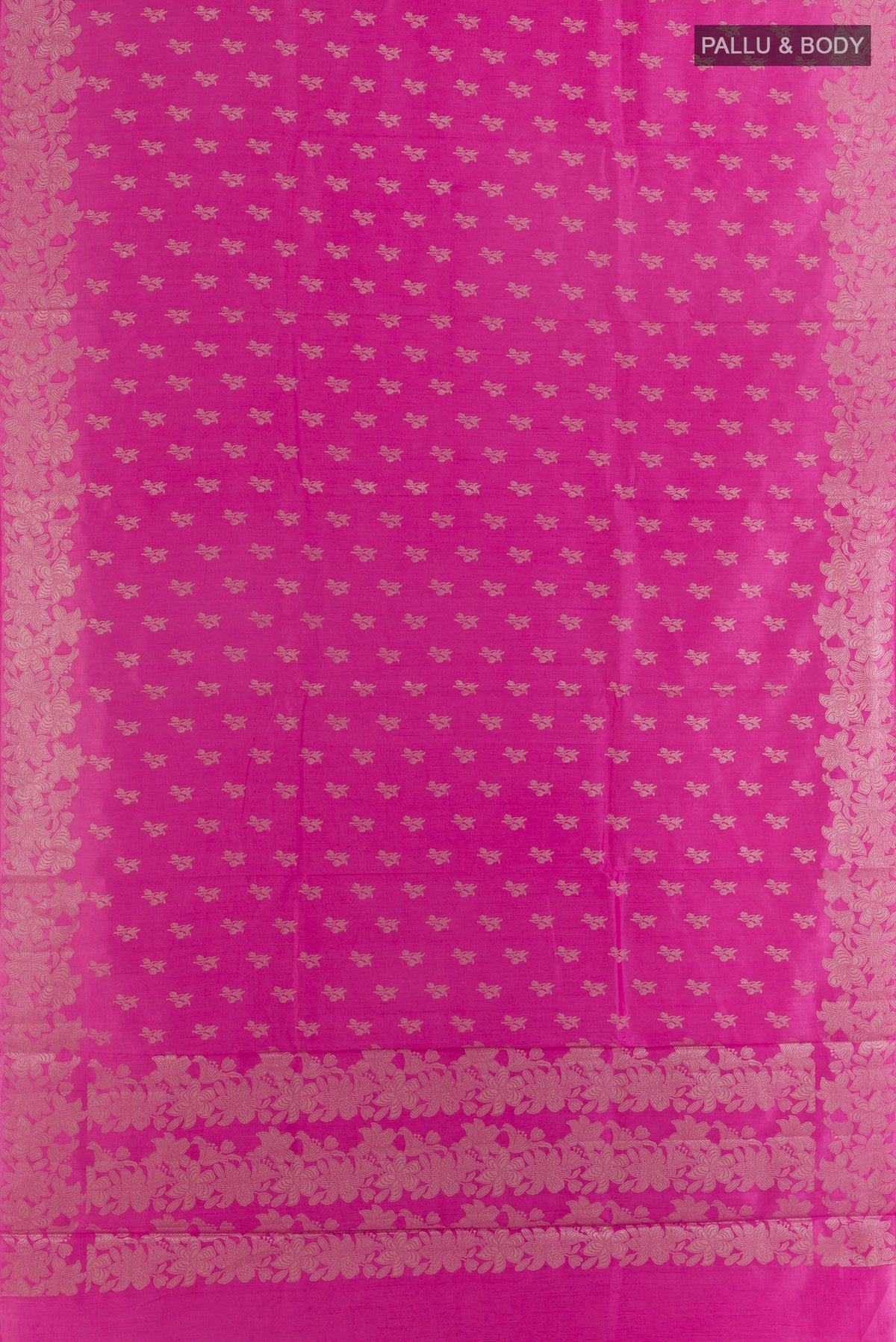 Flat view of Pink Tussar Saree with Zari Butta on the body and Zari Border. 