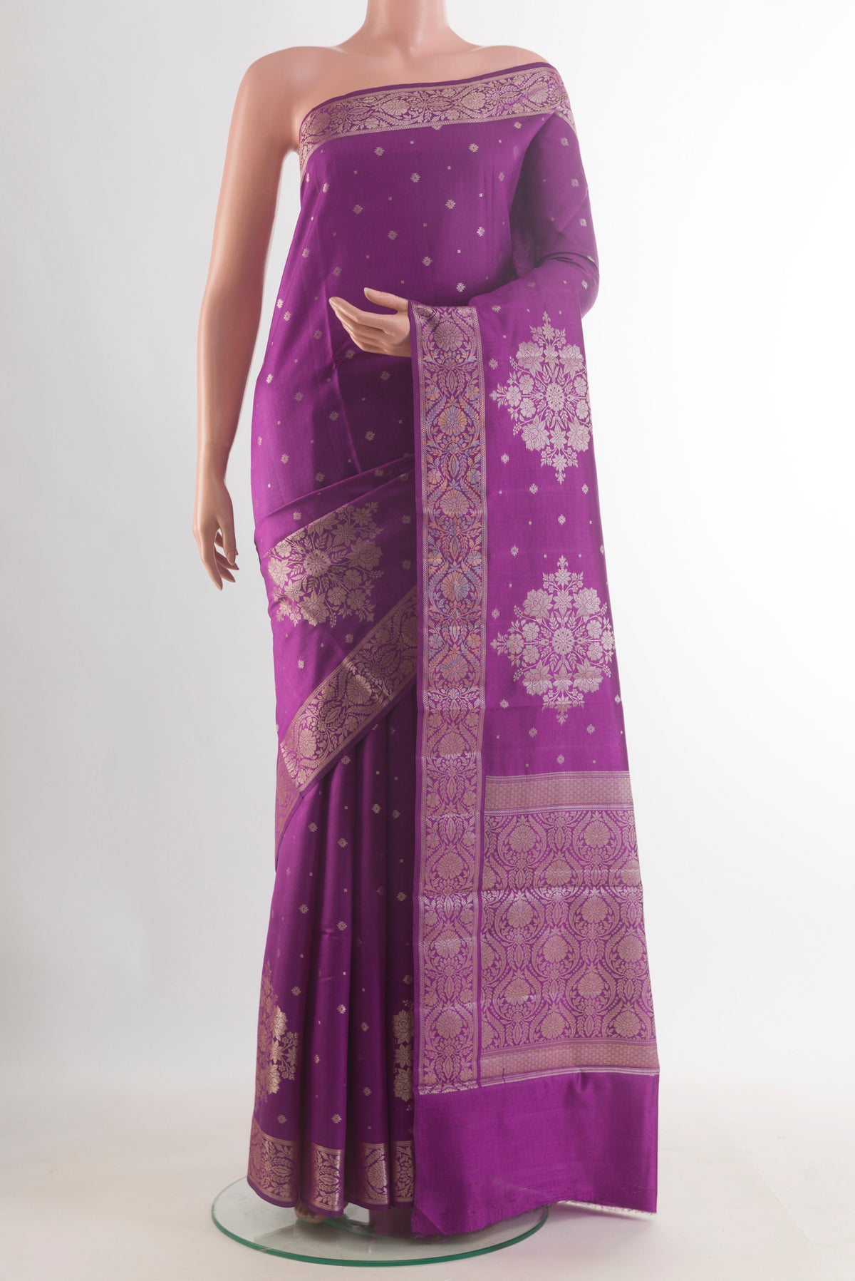 Purple Tussar Saree with Zari Butta on the body and Zari Border.  displayed on a mannequin