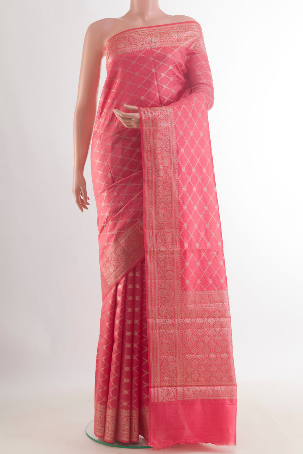 Coral Tussar Saree with Zari Brocade on the body and Zari Border.  displayed on a mannequin