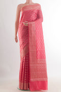 Coral Tussar Saree with Zari Brocade on the body and Zari Border.  displayed on a mannequin