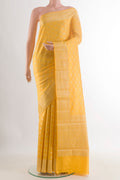 Yellow Tussar Saree with Zari Brocade on the body and Zari Border.  displayed on a mannequin
