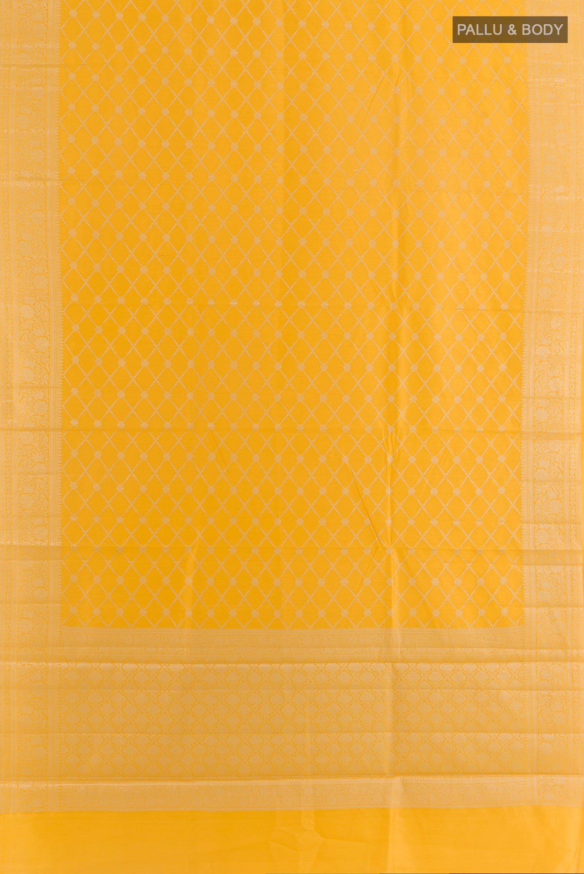 Flat view of Yellow Tussar Saree with Zari Brocade on the body and Zari Border. 