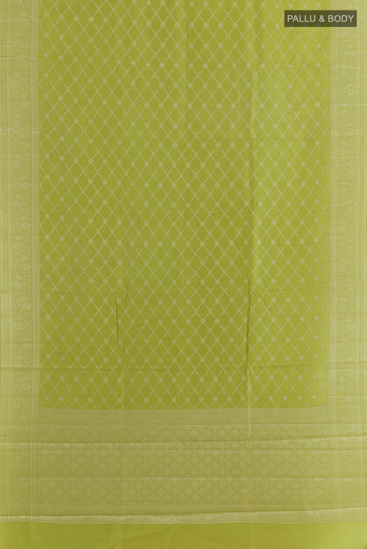 Flat view of Green Tussar Saree with Zari Brocade on the body and Zari Border. 