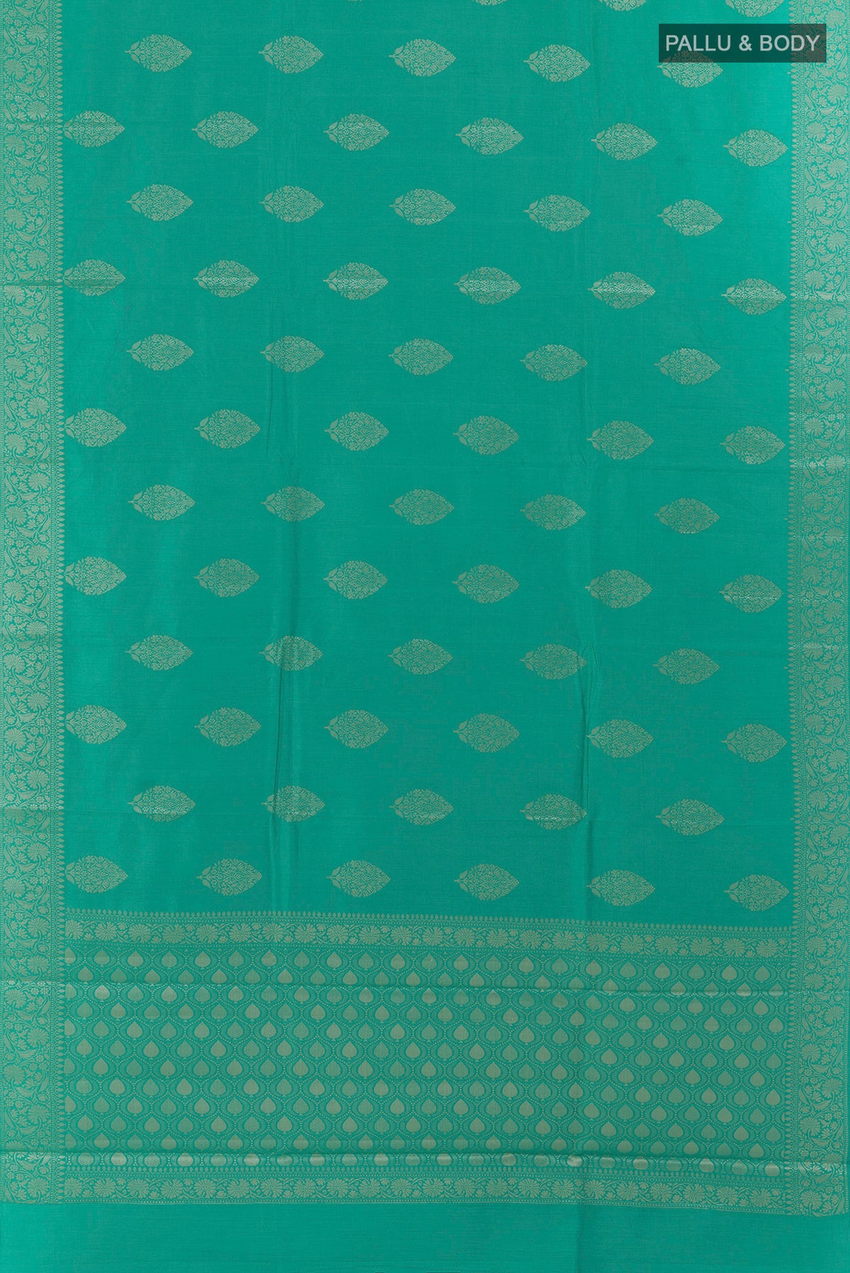 Flat view of Sea Green Tussar Saree with Zari Butta on the body and Zari Border. 