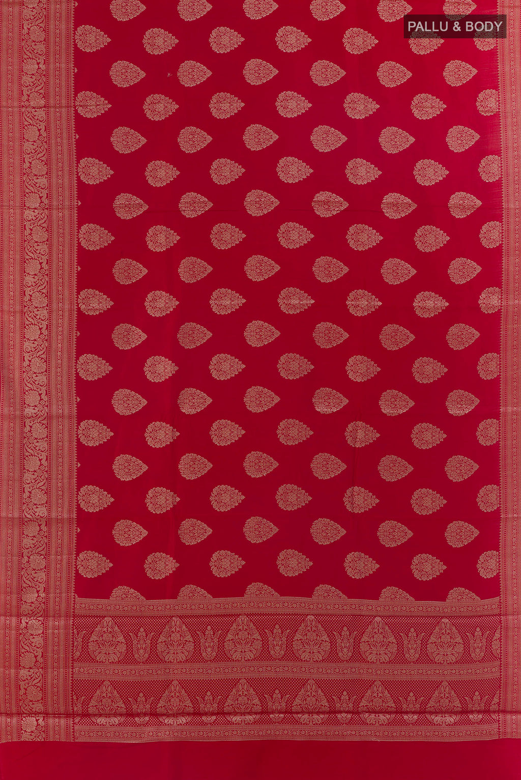 Flat view of Red Tussar Saree with Zari Butta on the body and Zari Border. 