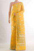 Yellow Tussar Saree with Zari Butta on the body and Zari Border.  displayed on a mannequin