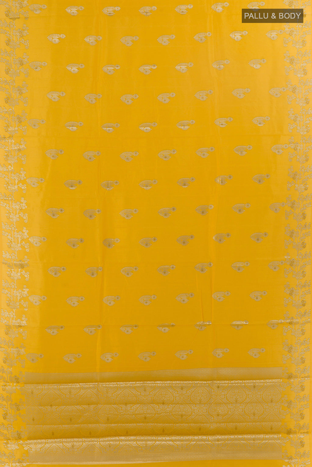 Flat view of Yellow Tussar Saree with Zari Butta on the body and Zari Border. 