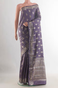 Lilac Tussar Saree with Zari Butta on the body and Zari Border.  displayed on a mannequin