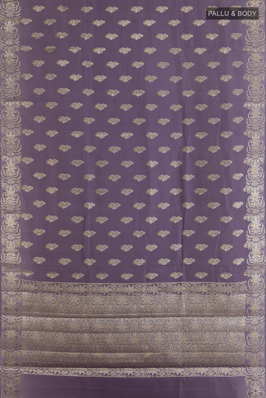 Flat view of Lilac Tussar Saree with Zari Butta on the body and Zari Border. 