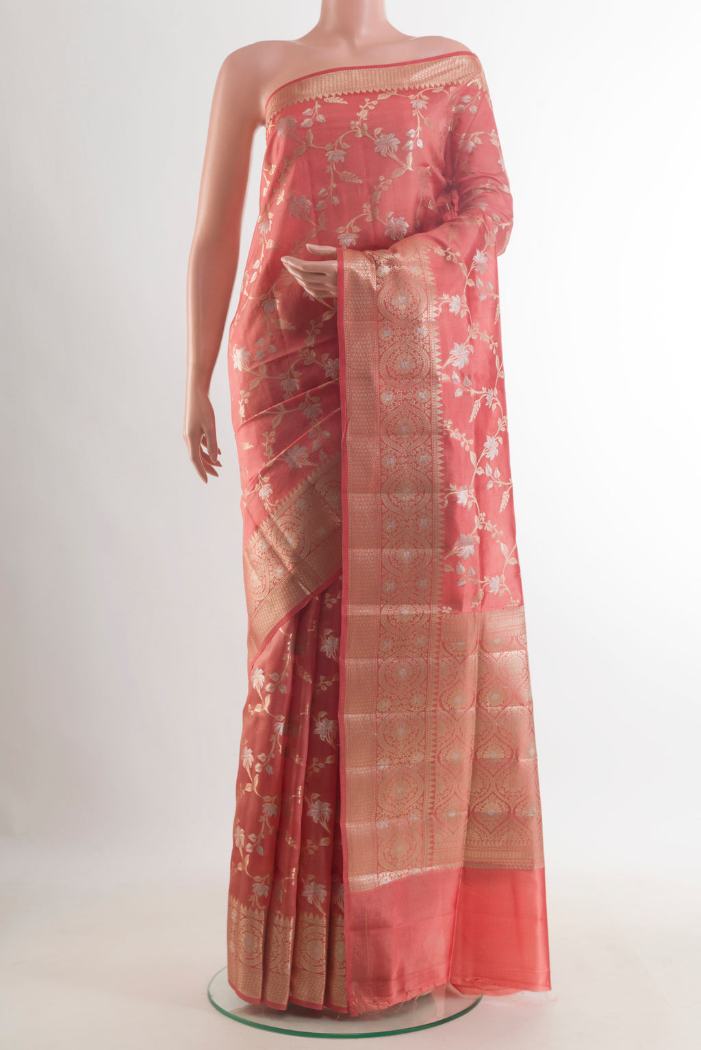 Pure Silk Peach Banarasi Raw Saree with Zari Brocade on the body and Zari Border.  displayed on a mannequin