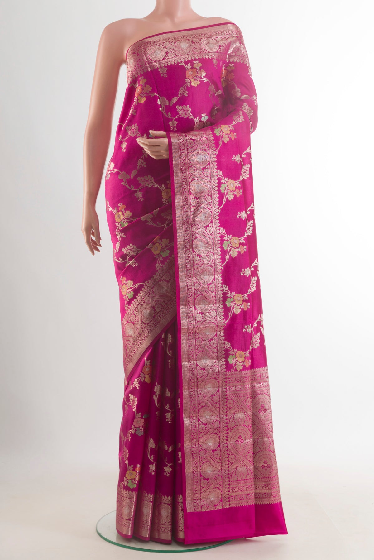 Pure Silk Dark Pink Banarasi Raw Saree with Zari Brocade on the body and Zari Border.  displayed on a mannequin