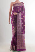 Pure Silk Purple Banarasi Raw Saree with Zari Butta on the body and Zari Border.  displayed on a mannequin