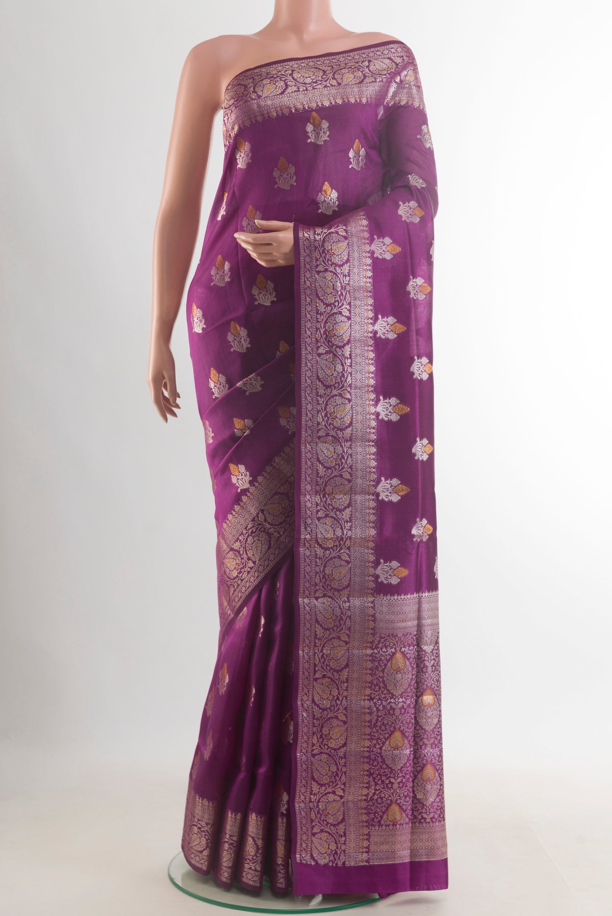 Pure Silk Purple Banarasi Raw Saree with Zari Butta on the body and Zari Border.  displayed on a mannequin