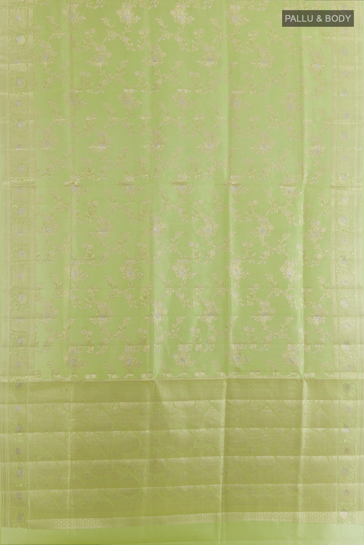 Flat view of Pure Silk Green Banarasi Raw Saree with Zari Brocade on the body and Zari Border. 