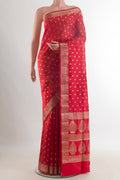 Pure Silk Red Banarasi Raw Saree with Zari Butta on the body and Zari Border.  displayed on a mannequin