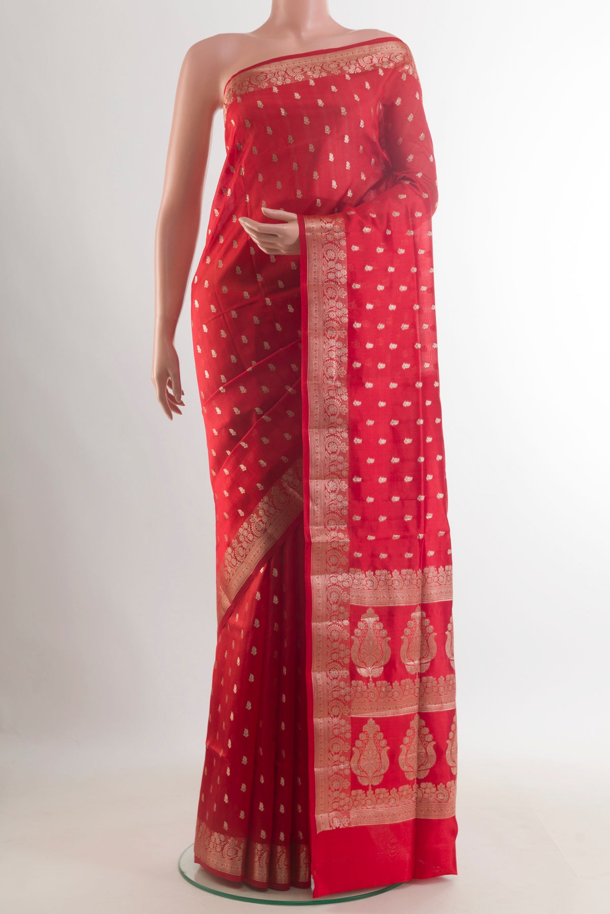 Pure Silk Red Banarasi Raw Saree with Zari Butta on the body and Zari Border.  displayed on a mannequin