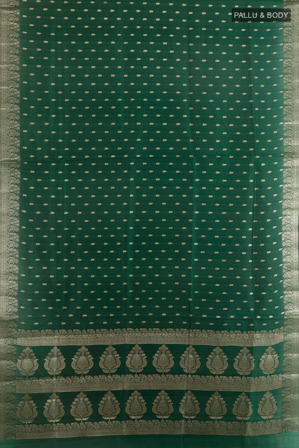 Flat view of Pure Silk Bottle Green Banarasi Raw Saree with Zari Butta on the body and Zari Border. 
