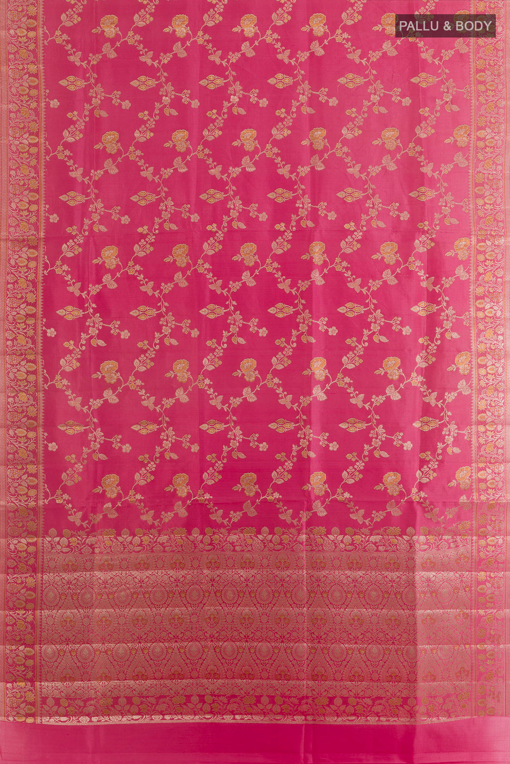 Flat view of Coral Banarasi Raw Saree with Zari Butta on the body and Zari Border. 