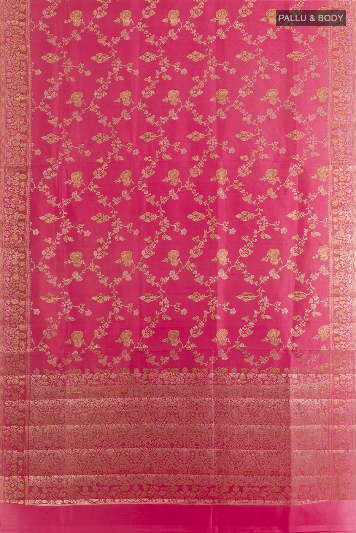 Flat view of Coral Banarasi Raw Saree with Zari Butta on the body and Zari Border. 