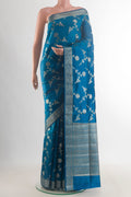 Pure Silk Blue Banarasi Raw Saree with Zari Brocade on the body and Zari Border.  displayed on a mannequin