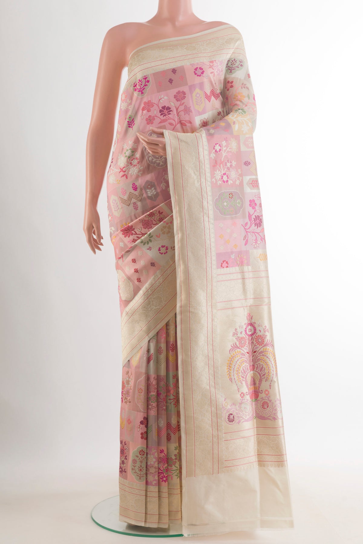 Pure Silk Peach Banarasi Saree with Zari And Thread Butta on the body and Zari Border.  displayed on a mannequin
