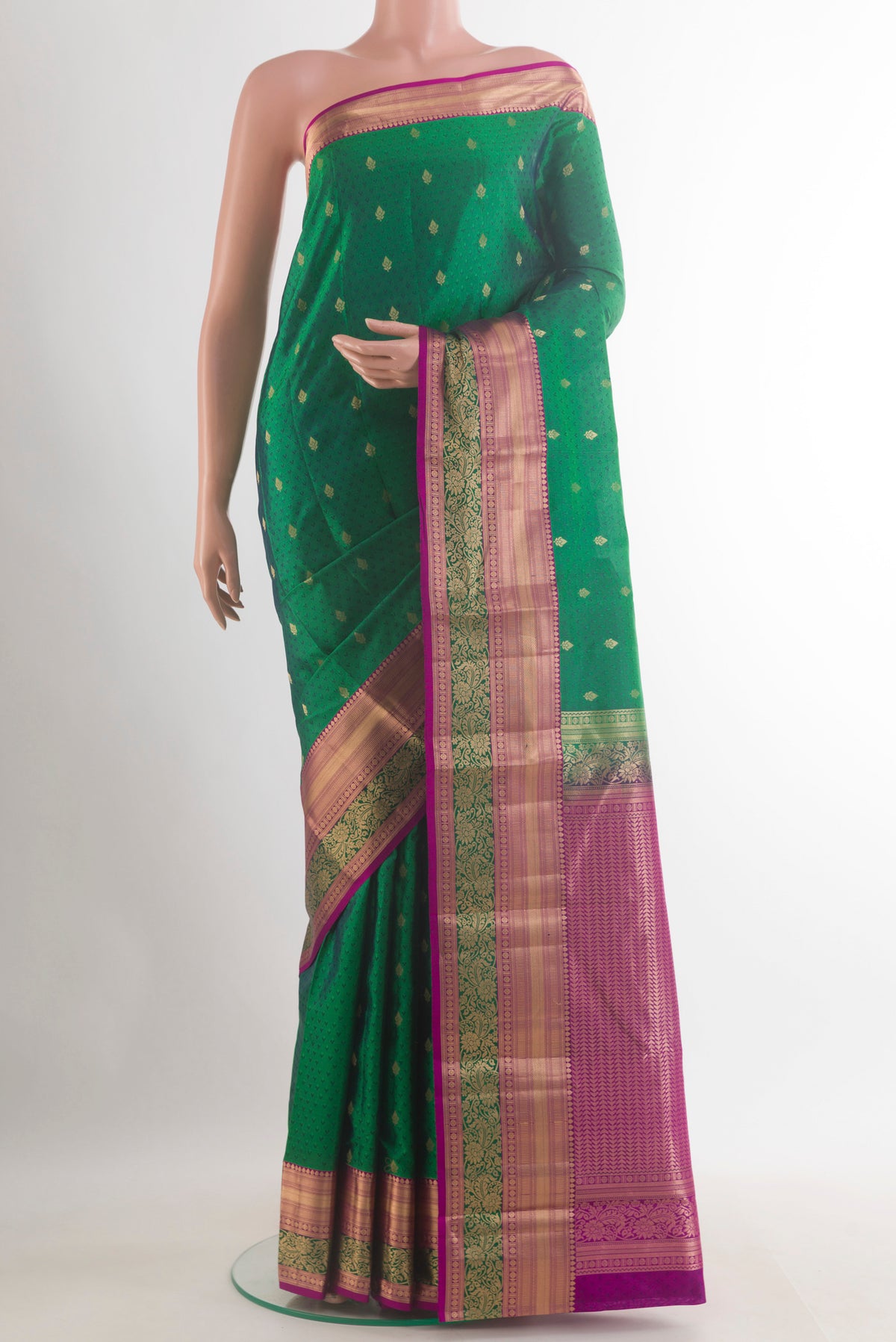 Pure Silk Green Kanchipuram Saree with Jacquard With Zari Butta on the body and Zari Border.  displayed on a mannequin