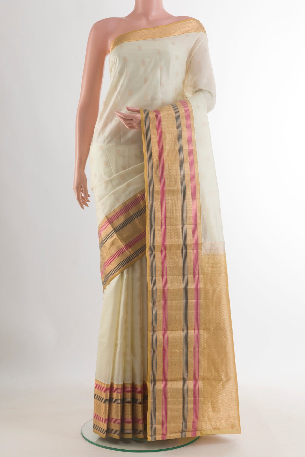 Pure Silk Off White Kanchipuram Saree with Zari Butta on the body and Zari Border.  displayed on a mannequin