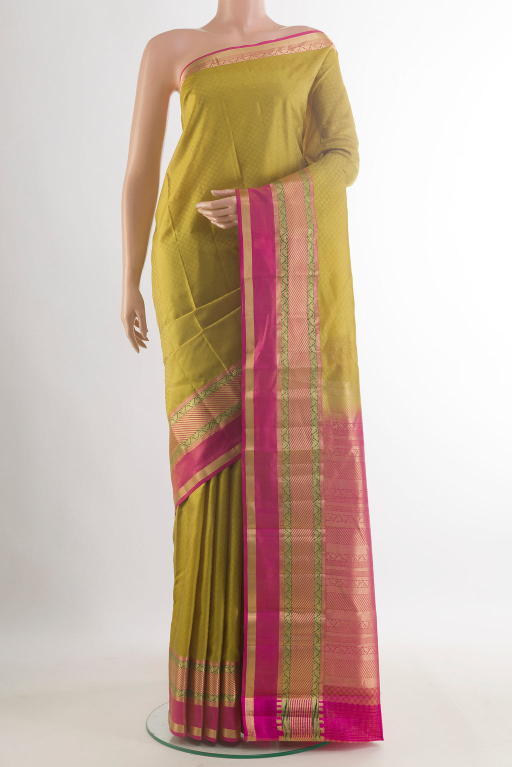 Pure Silk Green Kanchipuram Saree with Jacquard design on the body and Zari Border.  displayed on a mannequin