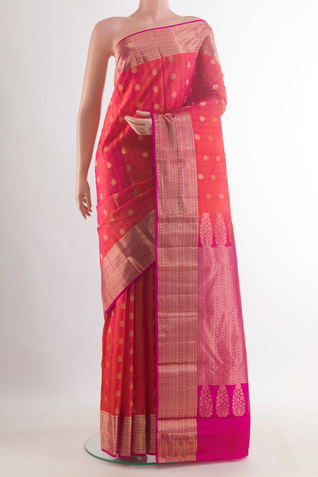 Pure Silk Brick Orange Kanchipuram Saree with Jacquard With Zari Butta on the body and Zari Border.  displayed on a mannequin