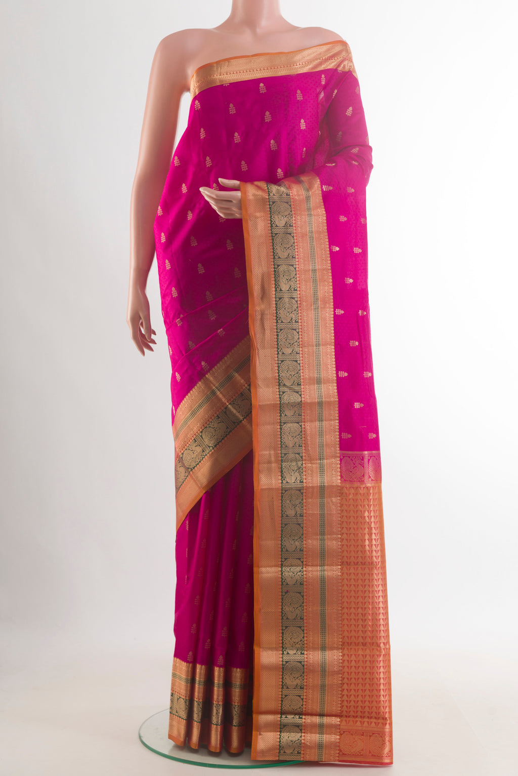 Pure Silk Pink Kanchipuram Saree with Jacquard With Zari Butta on the body and Zari Border.  displayed on a mannequin