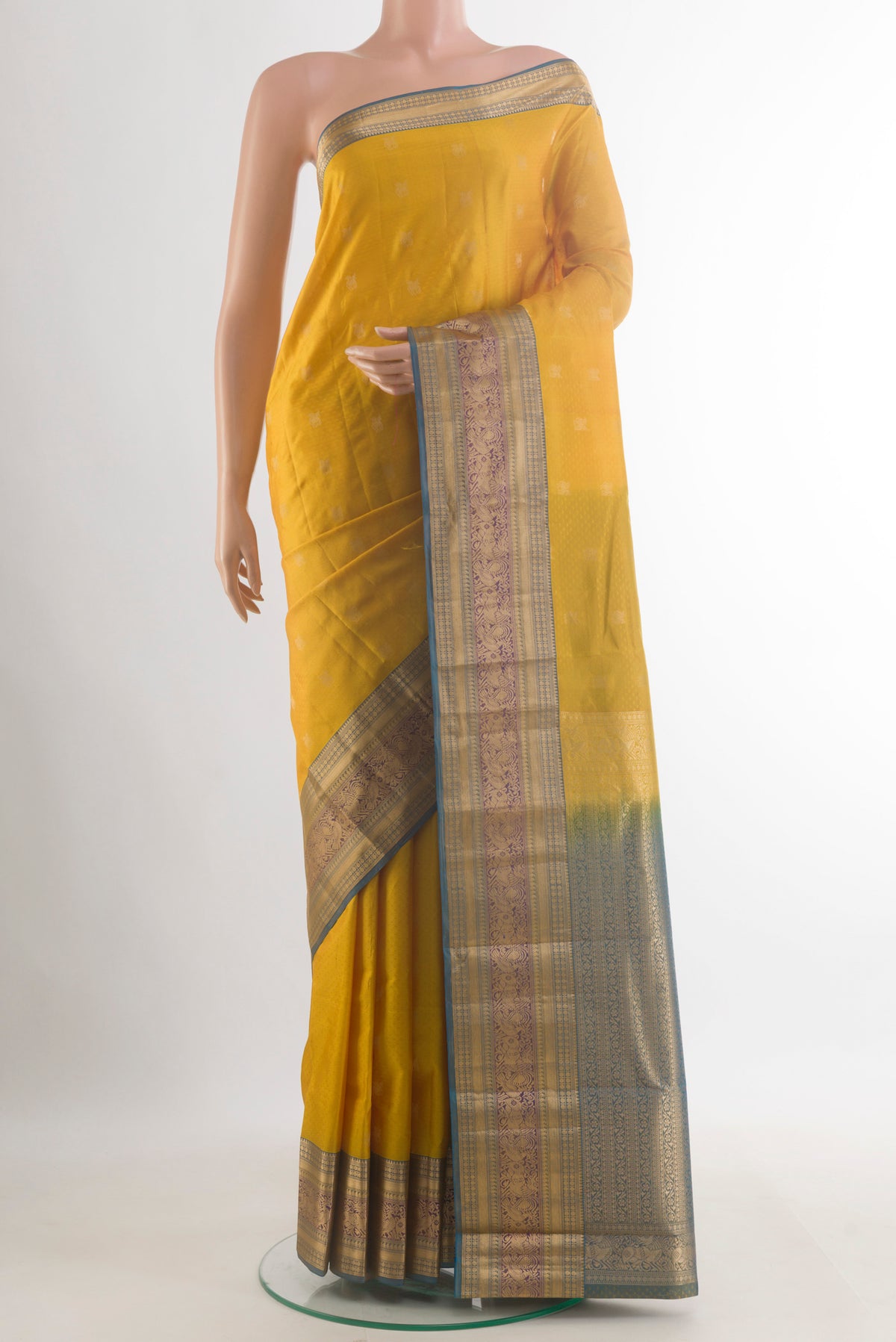 Pure Silk Yellow Kanchipuram Saree with Jacquard With Zari Butta on the body and Zari Border.  displayed on a mannequin