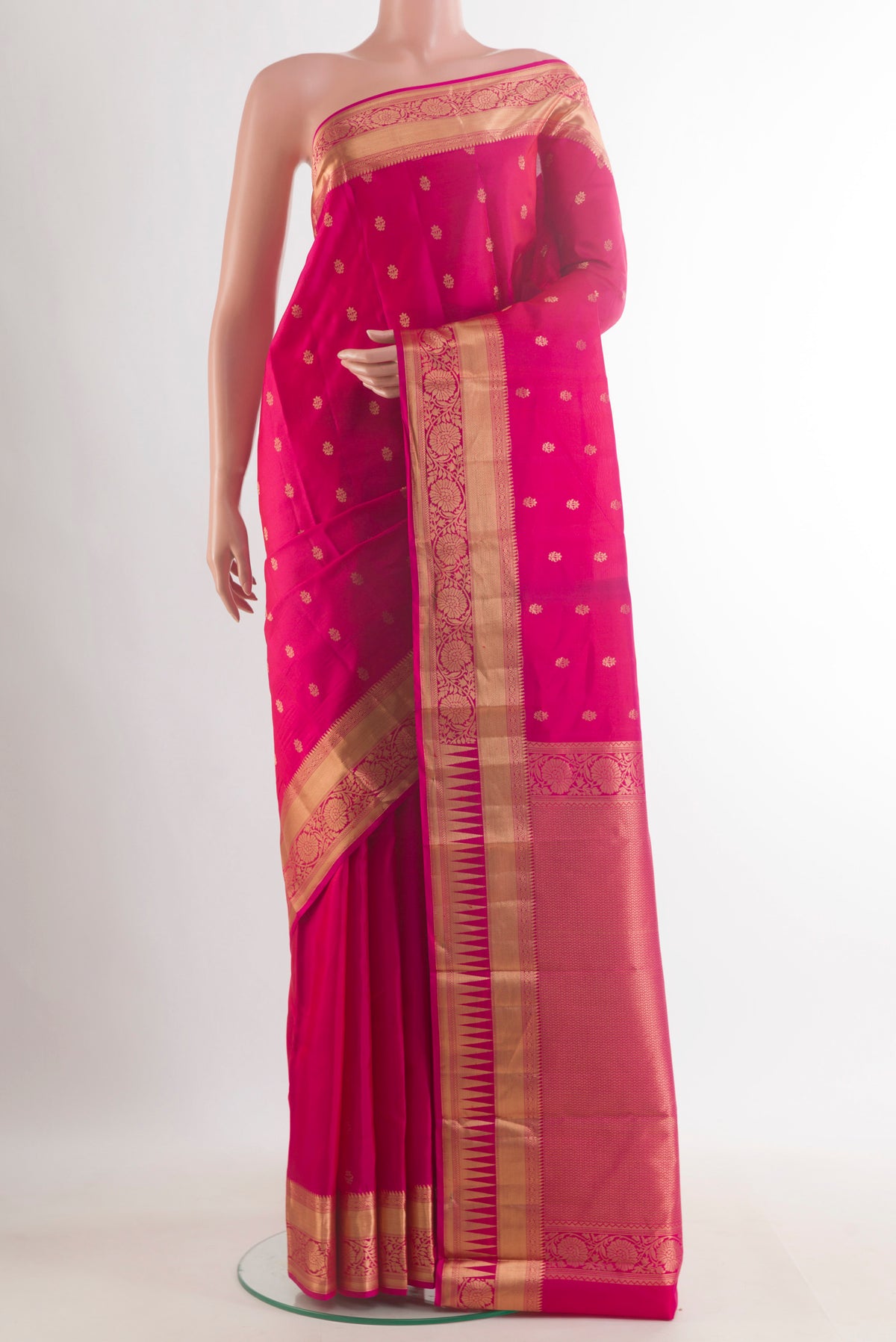 Pure Silk Pink Kanchipuram Saree with Zari Butta on the body and Zari Border.  displayed on a mannequin