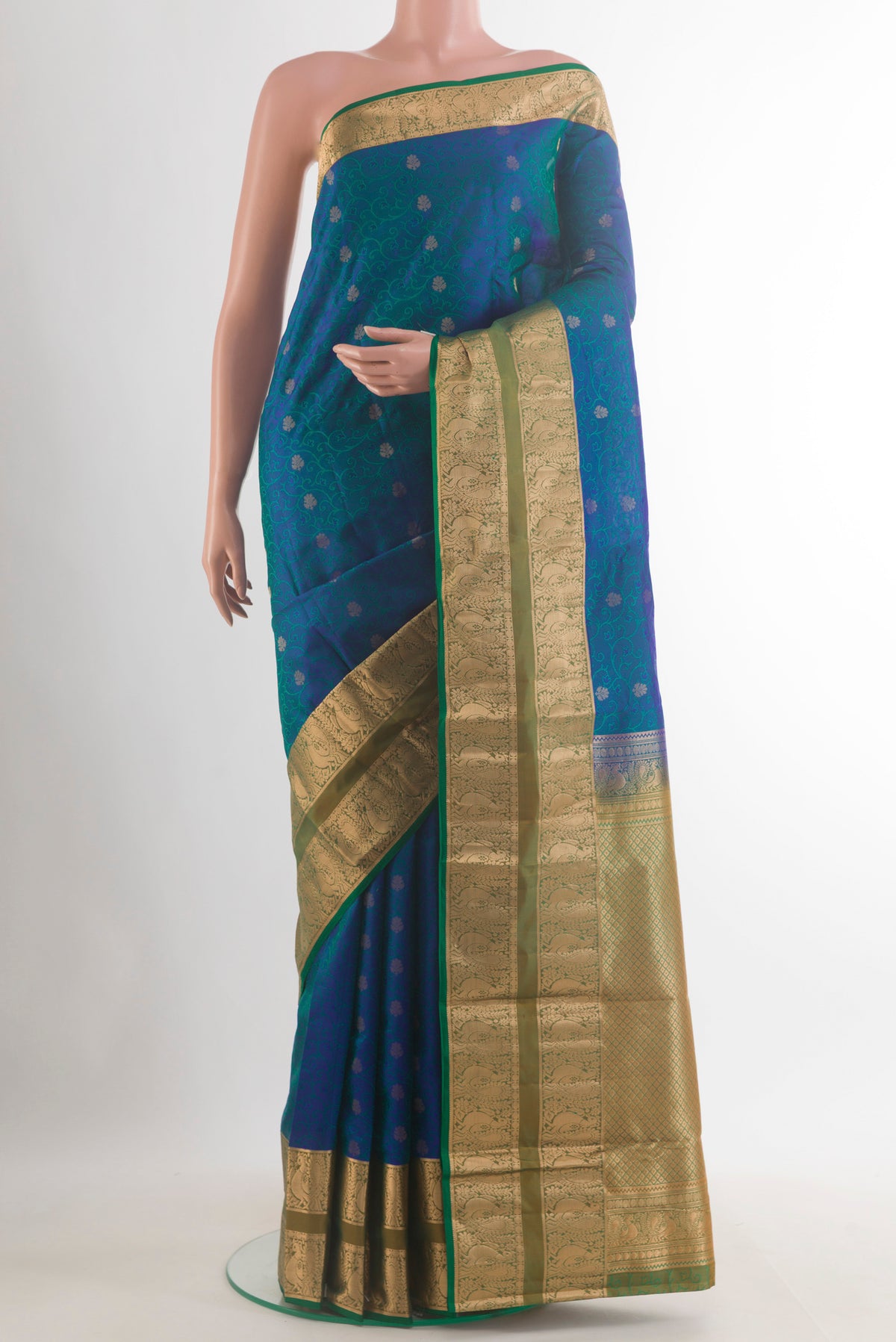 Pure Silk Peacock Blue Kanchipuram Saree with Jacquard With Zari Butta on the body and Zari Border.  displayed on a mannequin