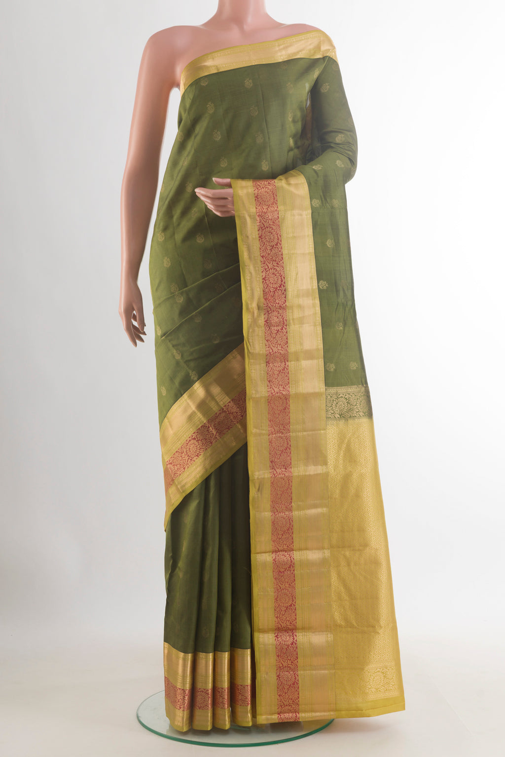 Pure Silk Olive Green Kanchipuram Saree with Zari Butta on the body and Zari Border.  displayed on a mannequin