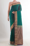 Pure Silk Green Kanchipuram Saree with Jacquard design on the body and Zari Border.  displayed on a mannequin