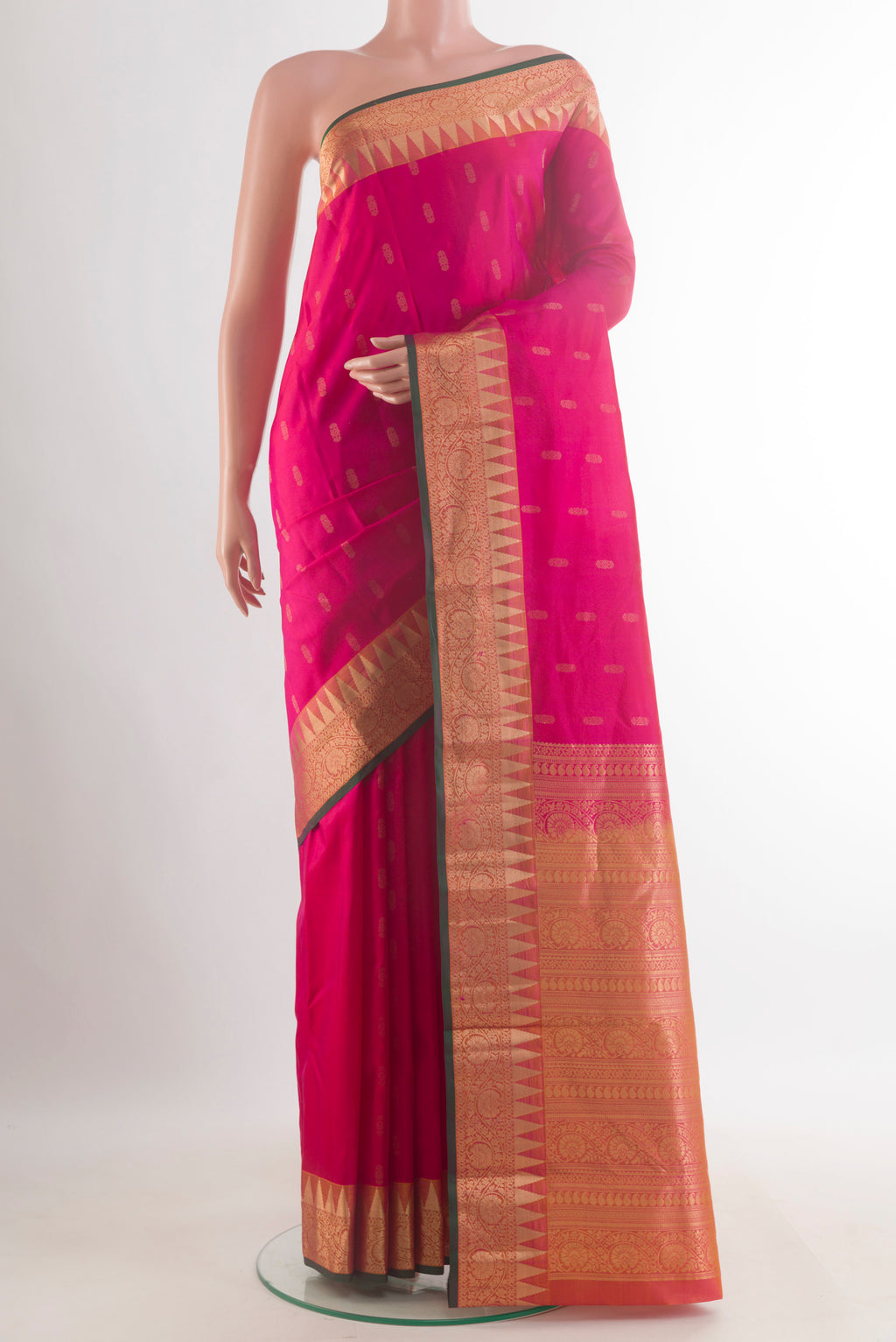 Pure Silk Pink Kanchipuram Saree with Zari Butta on the body and Zari Border.  displayed on a mannequin