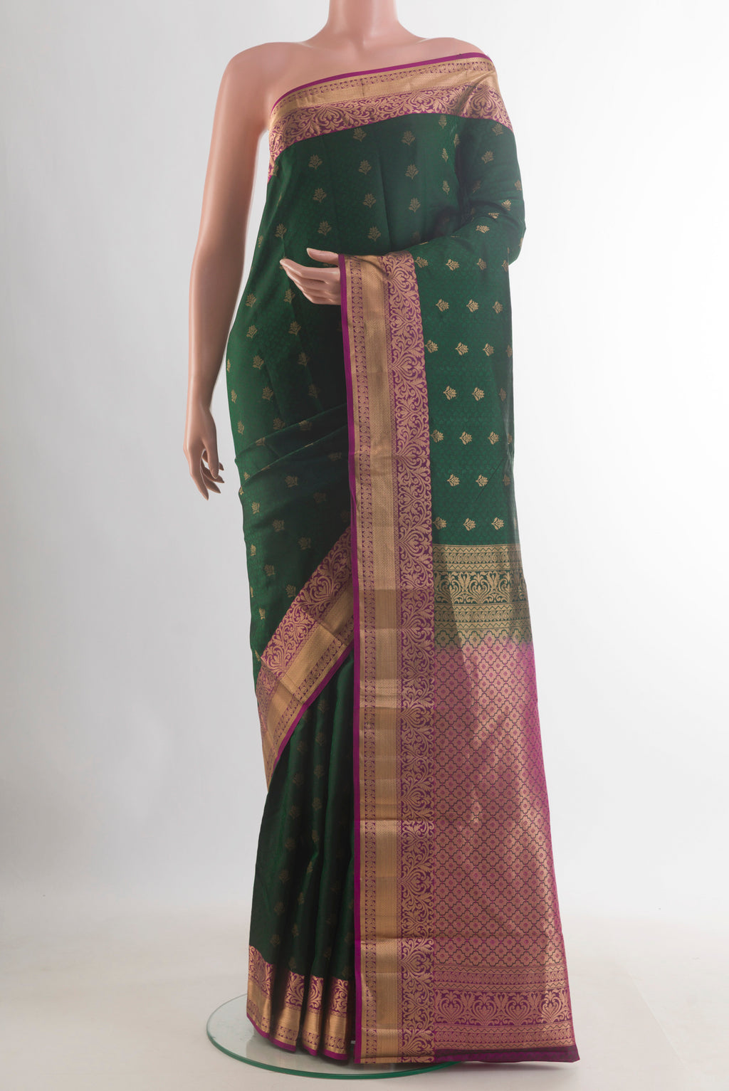 Pure Silk Bottle Green Kanchipuram Saree with Jacquard With Zari Butta on the body and Zari Border.  displayed on a mannequin