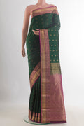 Pure Silk Bottle Green Kanchipuram Saree with Jacquard With Zari Butta on the body and Zari Border.  displayed on a mannequin